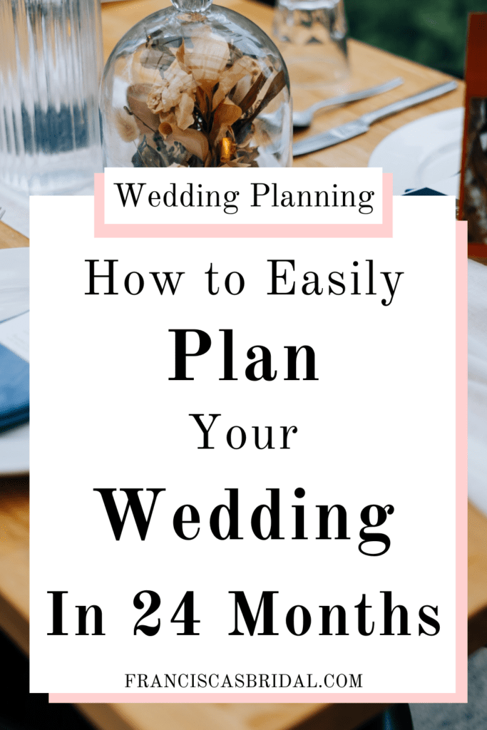 A wooden table at a wedding with white plates, clear cups, and a pile of leaves with a fake candle as the centerpiece with text over the photo that says planning a wedding in 24 months.