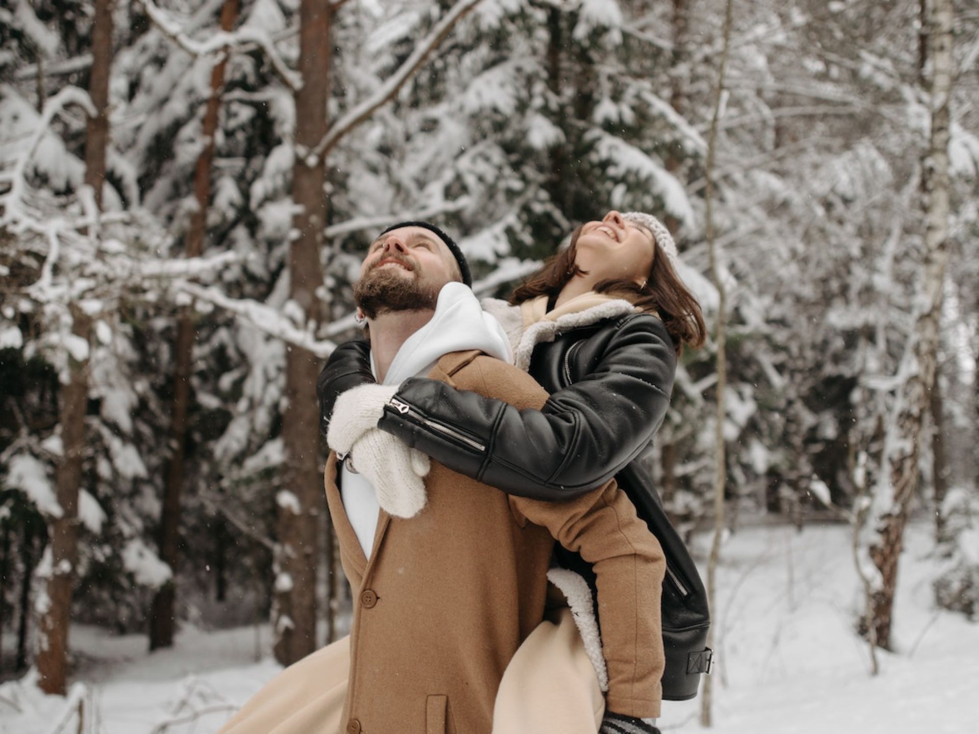 A couple standing in the snow.