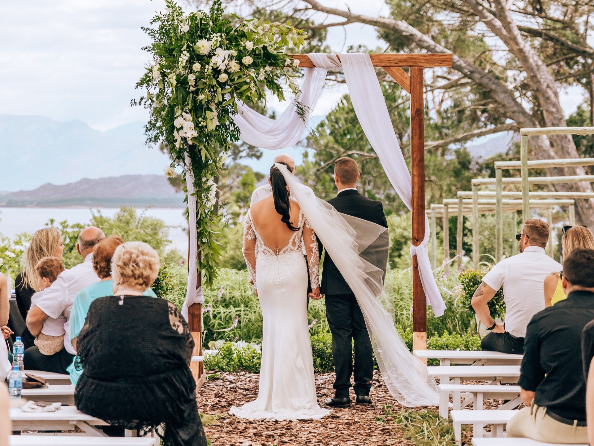A bride and groom at the altar.