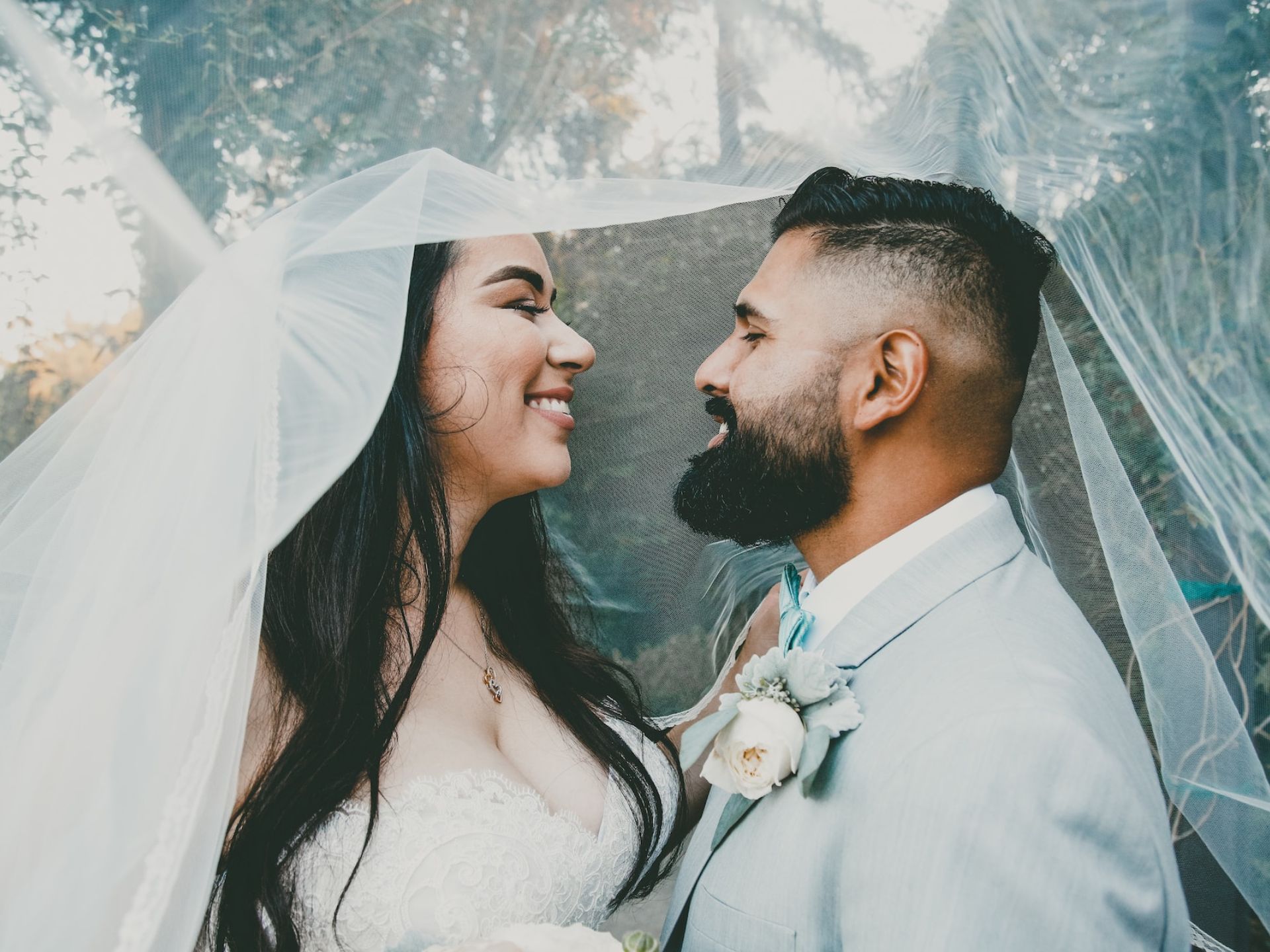 A bride and groom kissing.