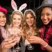 A group of girls wearing costumes at the club.