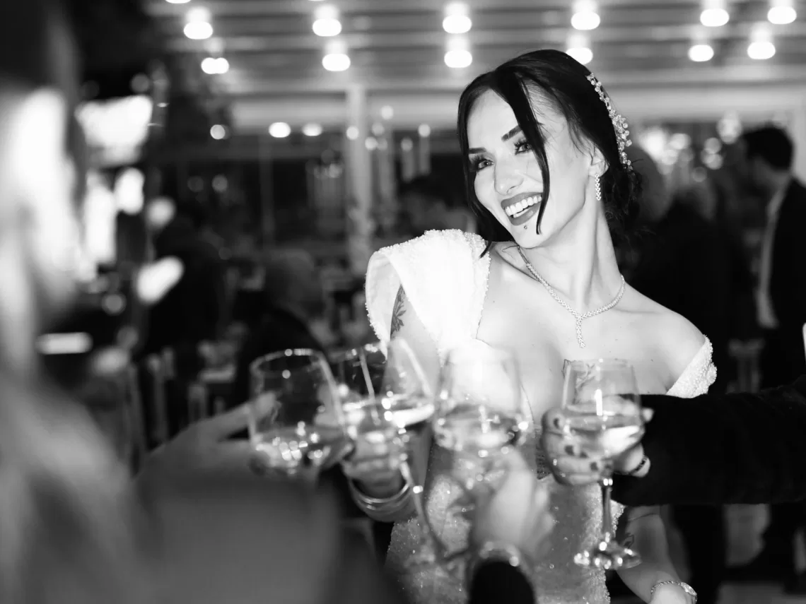 A bride having a champagne toast with her family.