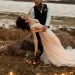 A bride and groom at an outdoor fall wedding.