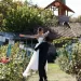 A bride and groom at a vineyard themed wedding.