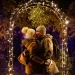 A couple kissing under the mistletoe.