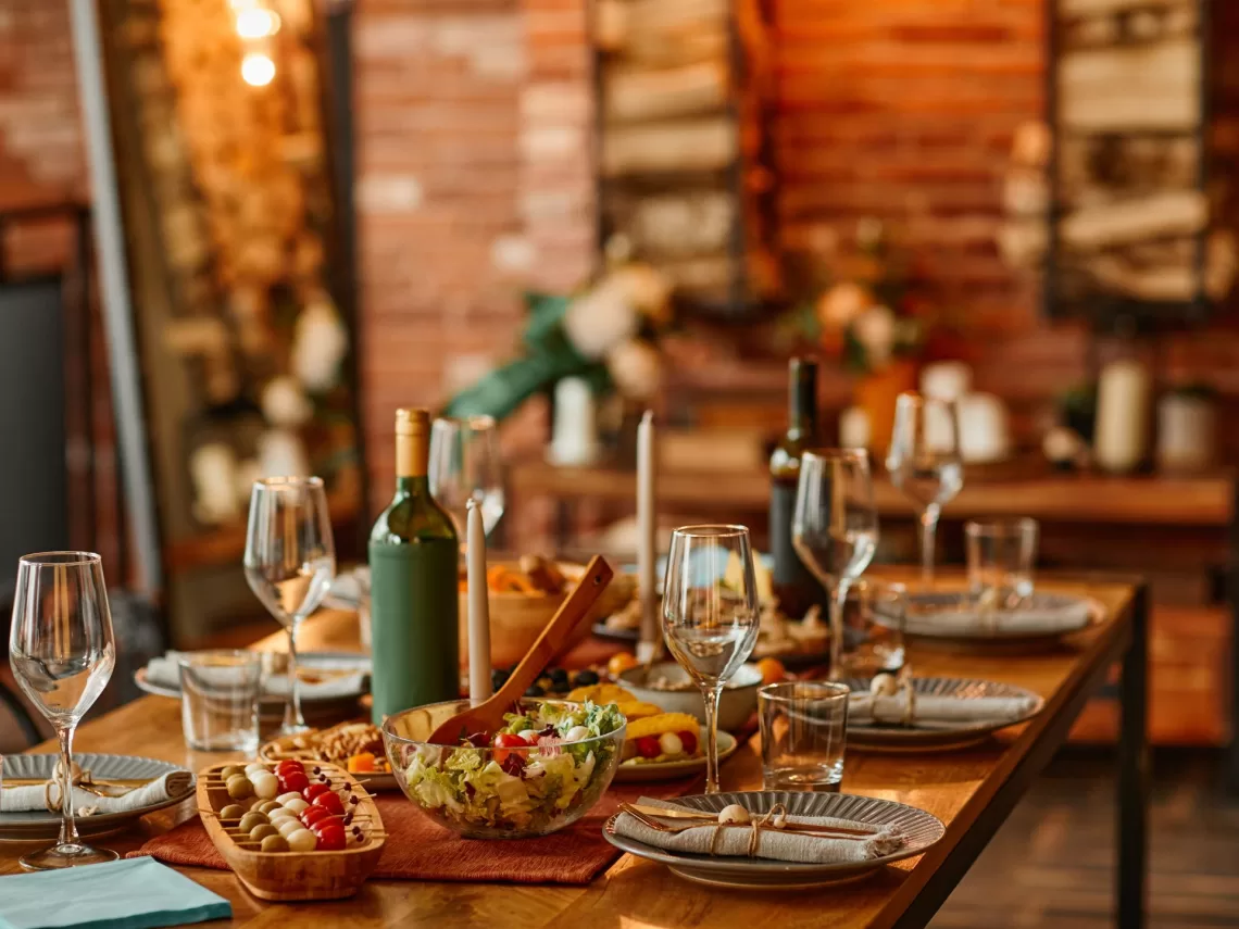 A table with charcuterie items inside of a cabin.