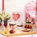 A board with valentine's treats and drinks.