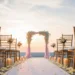 A beach front sunset wedding ceremony.