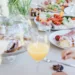A wedding table filled with wedding brunch food and drink ideas.