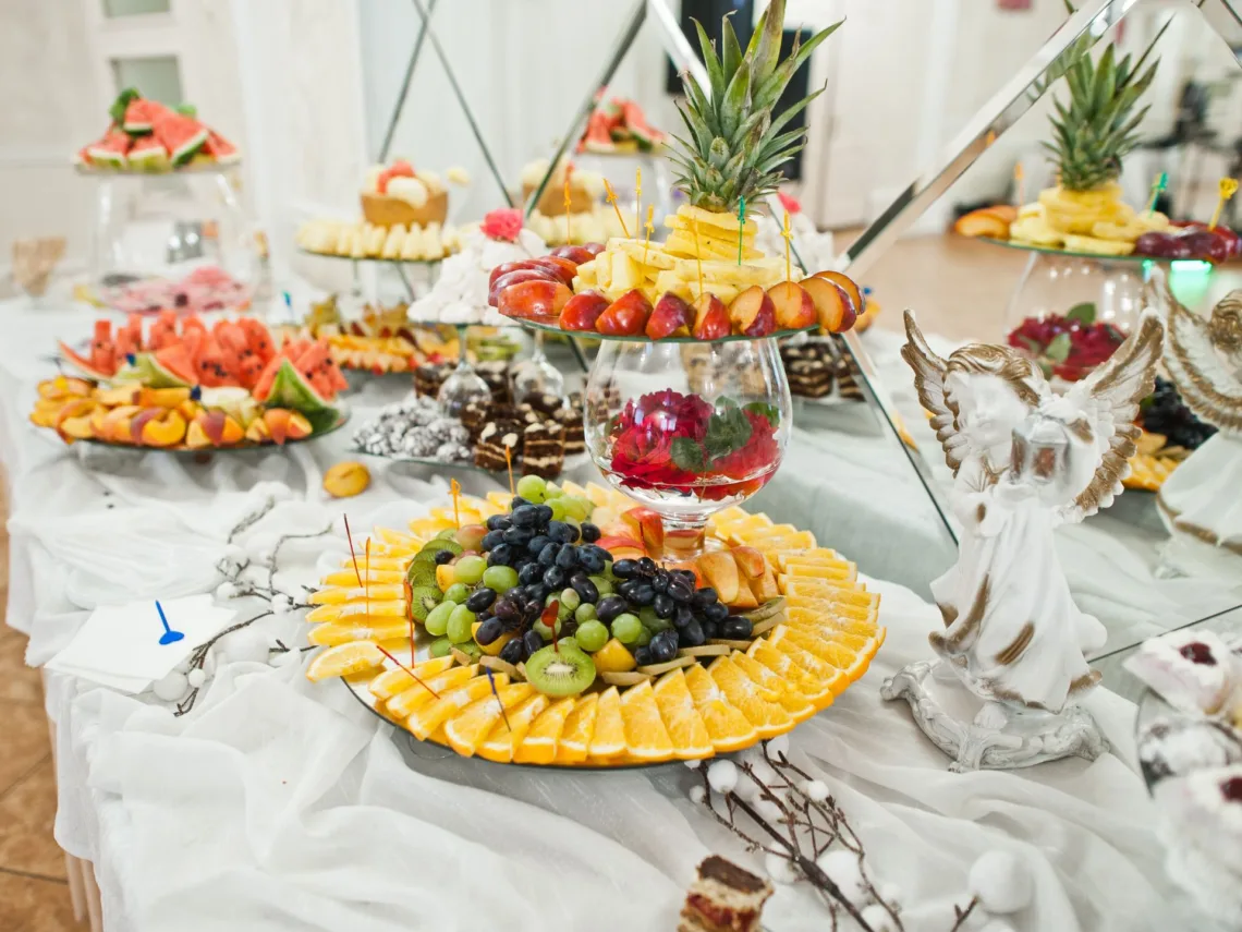 A wedding table with charcuterie items.