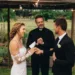 A bride and groom at an outdoor wedding.